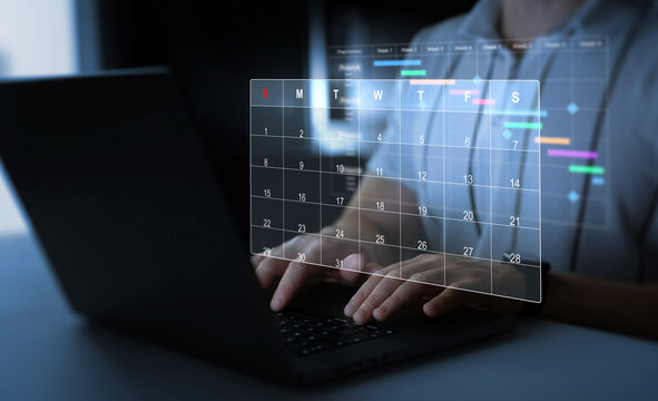Man manages time to work efficiently and on time on all projects.Calendar work schedule, business plan concept.Managing a scheduled meeting.