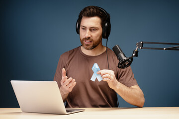 Radio host speaking about prostate cancer prevention during podcast recording