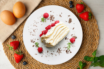 Milecrepe tart. Crepe and cream cake decorated with lime and raspberries. Top view table.