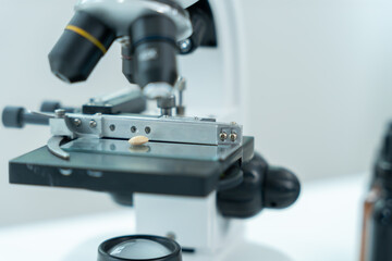 Scientist analyze biochemical samples in advanced scientific laboratory. Medical professional use microscope look microbiological developmental of viral. Biotechnology research in science lab.