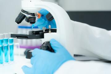 Scientist analyze biochemical samples in advanced scientific laboratory. Medical professional use microscope look microbiological developmental of viral. Biotechnology research in science lab.