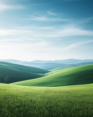 Obraz premium Rolling Green Hills: Serene landscape of gently rolling green hills under a vibrant blue sky, evoking a sense of peace and tranquility.