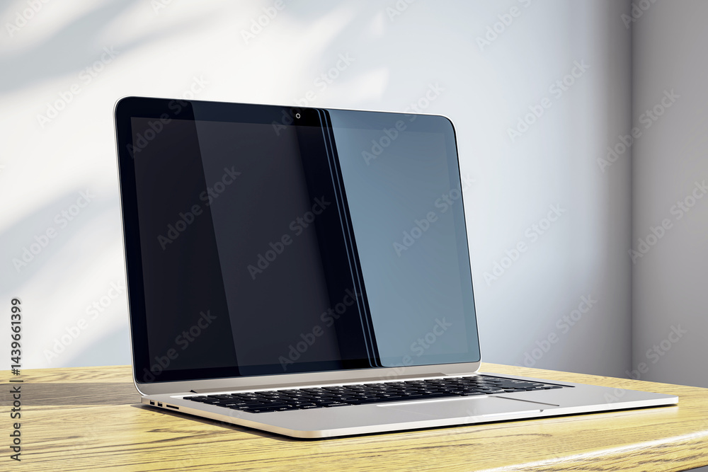 Aufkleber Modern laptop with blank screen on wooden desk in sunlit corner with soft shadows and minimalist background. 3D Rendering
