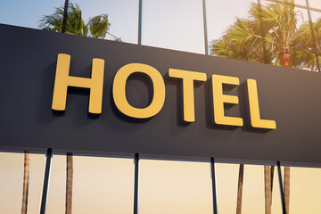 Closeup of hotel sign with five golden stars