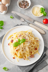 Traditional Italian pasta Carbonara. Spaghetti with bacon, egg and parmesan cheese. Top view, copy space.