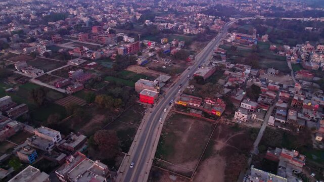Independent houses with agricultural land and Ayodhya dham road, day time, push in, drone shot, 4k.