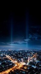 Night city lights aerial view, vertical shot, city lights illuminating the night sky, ideal for backgrounds