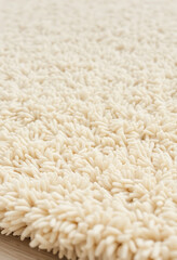 close up of a white rug on a wooden floor