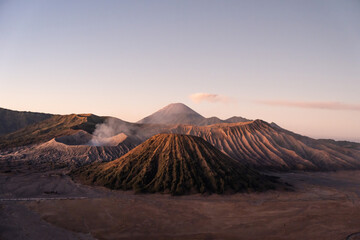 Mount bromo emitting smoke at sunrise in the bromo tengger semeru national park, indonesia