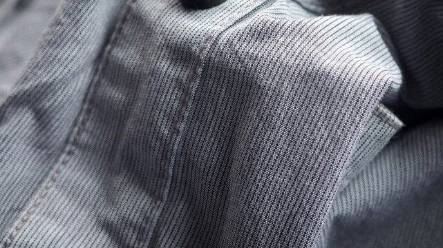 Grey pin stripe material extreme close up rotating very slowly stock footage