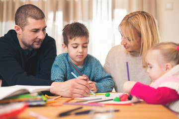 Happy family at home playing