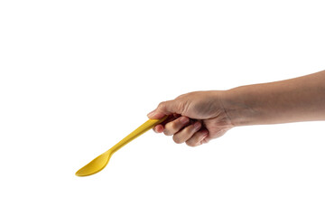 Fototapeta premium Yellow spoon and hand isolated on transparent background.
