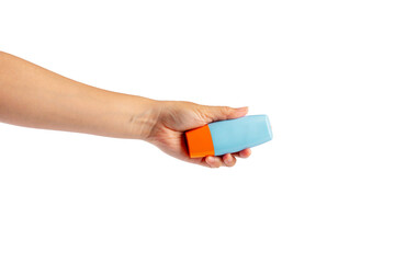 Blue cosmetic bottle in hand, Skin care or sunscreen cosmetic on transparent background.