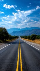 Naklejka premium Open road through mountains under a vibrant blue sky. Possible use Travel brochure, tourism advertisement