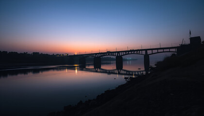 Obraz premium Jhelum River under Dograi Bridge at twilight, Indian and Pakistani bunkers on opposite banks. Silhouettes of soldiers, faint glow of floodlights. 8K moody, war-torn