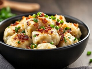 Bowl of pierogi with bacon bits