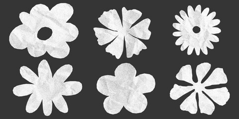 Obraz premium Set of flower silhouettes with crumpled paper texture on dark background. Cute stickers made from notebook with jagged torn edges, dotted gritty texture, halftone elements.