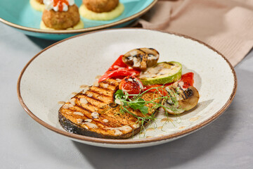 Salmon Steak with Grilled Vegetables Vibrant Gourmet Presentation in Natural Light