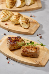Grilled meat and poultry set with chicken fillet, turkey fillet, pork tenderloin, bright lighting, minimalistic styling
