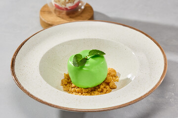 Elegant apple mousse cake on textured plate, minimalistic bright lighting with soft natural color tones
