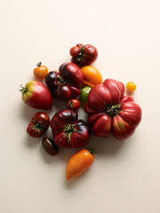 Sweet farm tomatoes over beige background