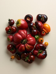 Sweet farm tomatoes over beige background