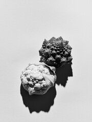 black and white photo of fresh cabbage, broccoli, cauliflower