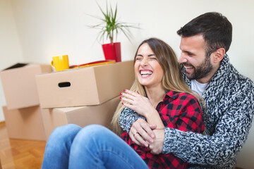 Young couple moving in to a new apartment. Shallow DOF. Developed from RAW; retouched with special...