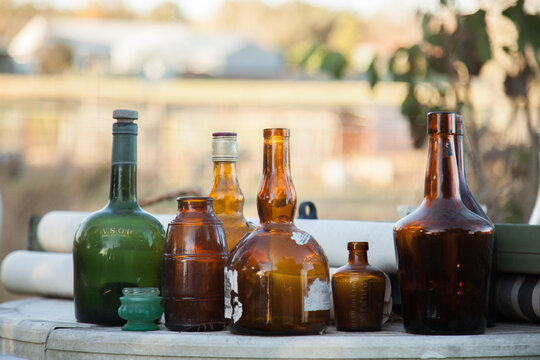 Fototapeta Collection of old vintage bottles on table