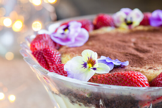 trifle dessert in crystal bowl with fairy lights