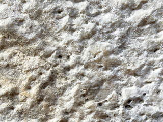 Textured close-up of natural rock surface with irregular patterns