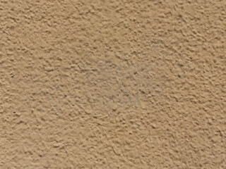 Close-up of textured beige concrete wall surface