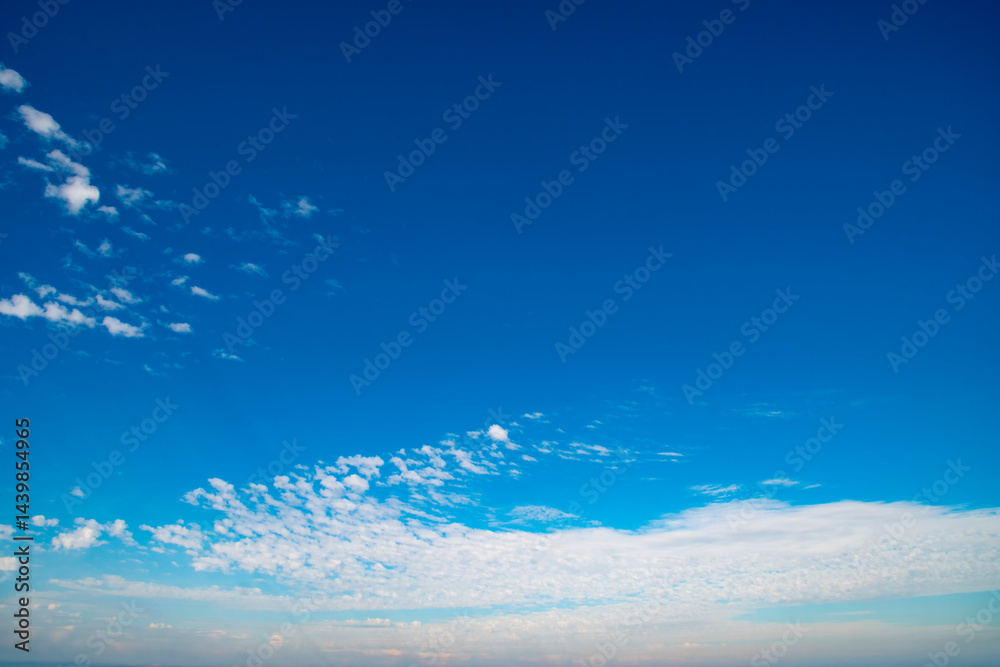 Wall mural background with calm blue sky and white cumulus clouds. relaxing backdrop on the theme of weather an