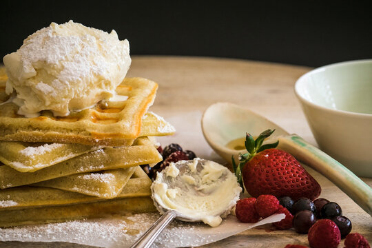 Waffles and ice cream with fresh berries