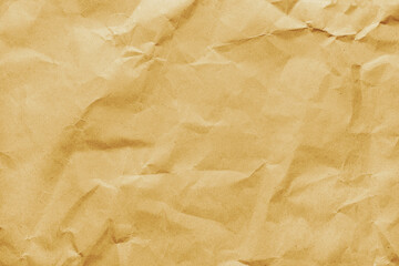 Recycled crumpled yellow colored paper texture. Wrinkled craft paper background, rough cardboard...
