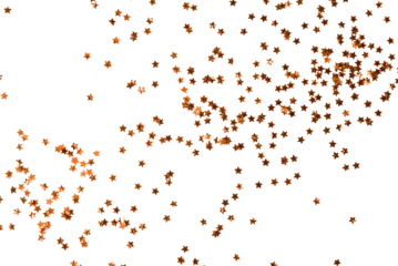 Festive golden stars of confetti isolated on a transparent background.