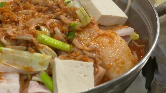 Spicy codfish stew being prepared