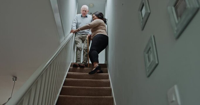 Senior, man or caregiver for support on stairs with walking stick, helping or guide in hospice or house. Elderly, person or woman and communication, steps or handicap in retirement home for volunteer