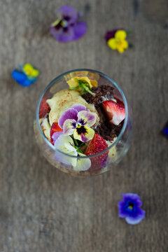 trifle in a glass, fun version with chocolate cake and edible flowers