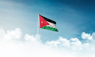 Jordan national flag with mast waving in beautiful sky. Jordan flag for Republic Day and Independence Day.