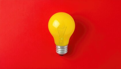 Yellow light bulb a red background, a flat lay banner design for a business concept