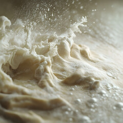 Baking Dough Splashing Up Close: A dynamic close-up shot of freshly prepared dough, captured at the precise moment of a splash, revealing a texture that evokes warmth and anticipation for baking. 