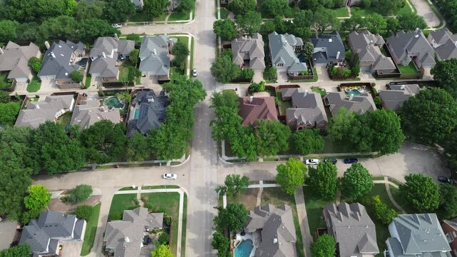 Lush green residential street with spacious two-story suburban houses in West Plano, Texas, modern inground pool, upscale neighborhood green space fast growing suburbs Dallas Fort Worth metroplex