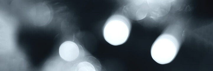 Blurred lights, gray, deep blue background, banner texture. Abstract bokeh with soft light header. Wide screen wallpaper. Panoramic web banner with copy space for design