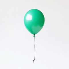 Floating green balloon captured against a white background in high resolution