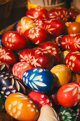 A vibrant display of intricately carved and colorful Easter eggs, perfect for spring.