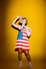 A joyful figure revels in patriotism, donning a dress adorned with the American flag. Bright yellow...