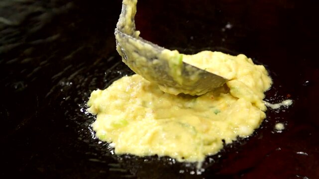 Mung bean pancake batter on an iron plate