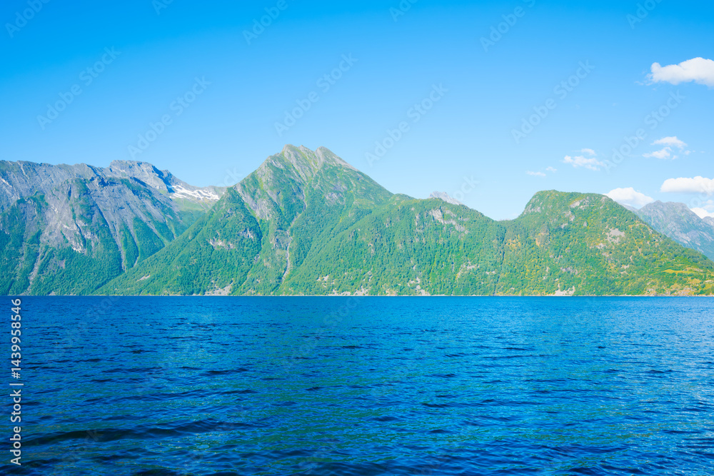 Wall mural nature in fjords. norway. high mountains and reflections on the surface of the water. place for moun