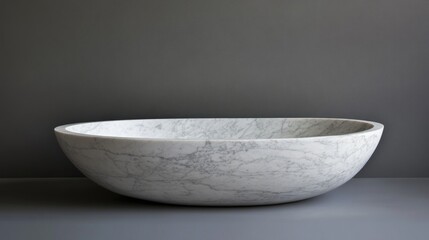 Oval marble bathtub, studio, gray background, luxury